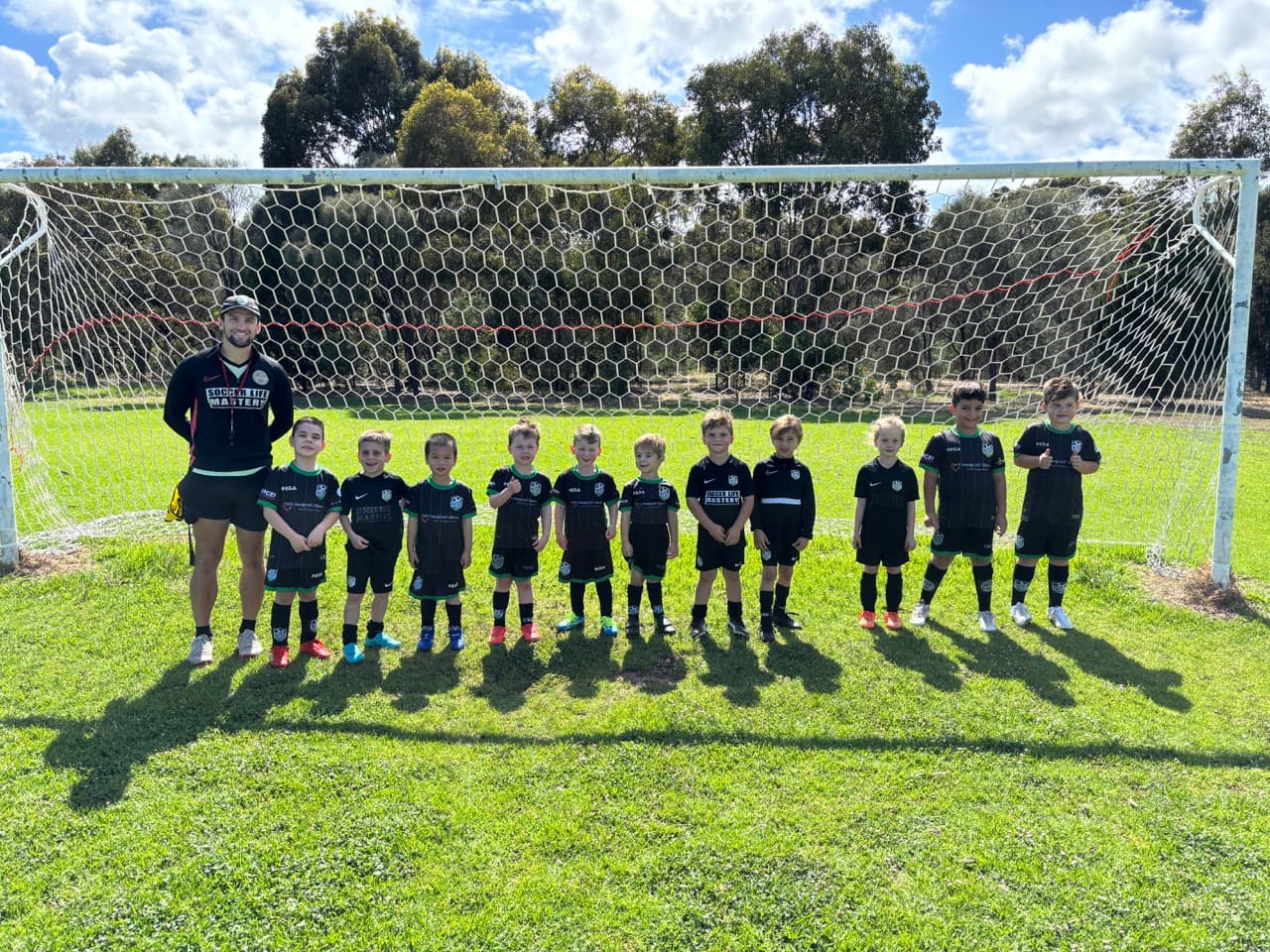 Mastery Football Academy players and coaches at an Adelaide training session