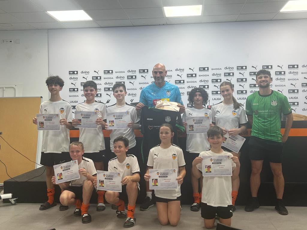 Mastery Football Academy players receiving Valencia CF Soccer Academy certificates at the LaLiga press room during the Spain Pathway tour