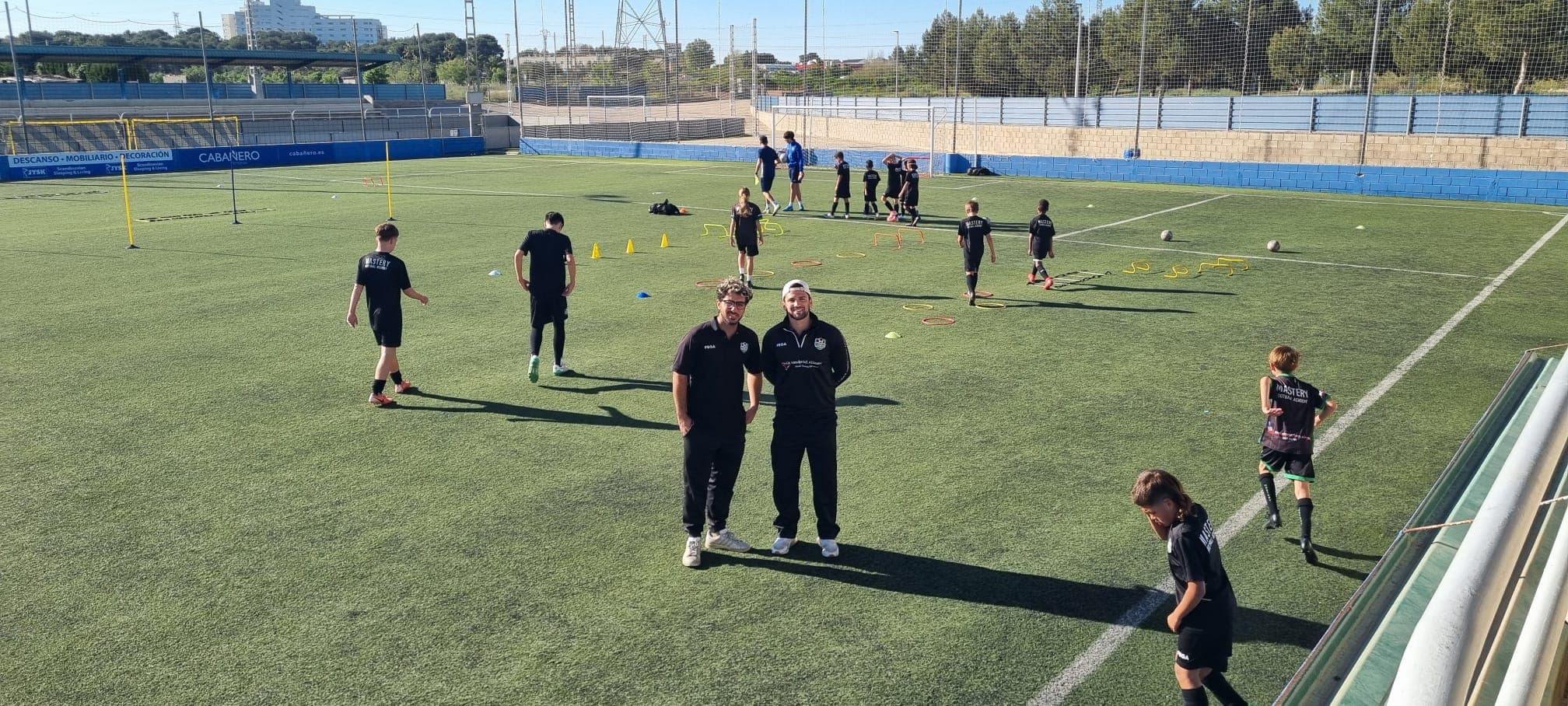 Mastery Football Academy coaches and players training on a Spanish pitch in Valencia