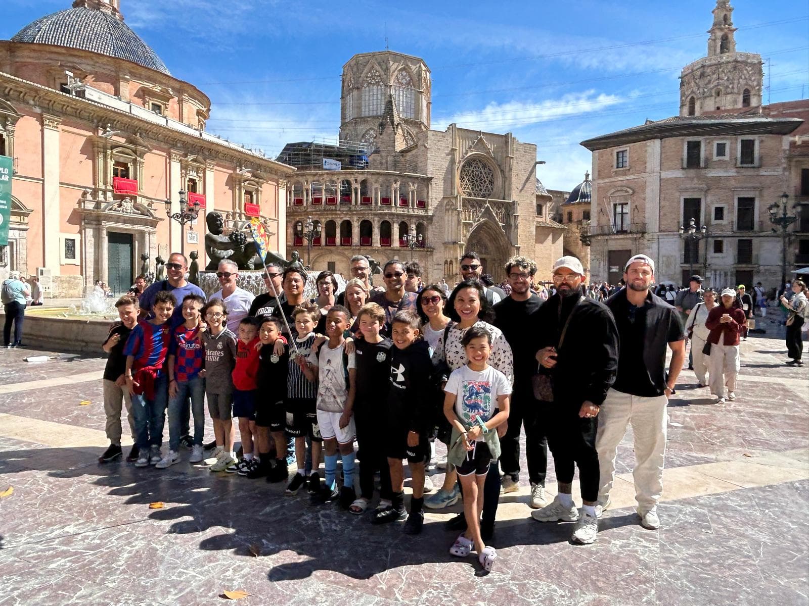 Mastery players and families at Valencia Cathedral plaza during city tour