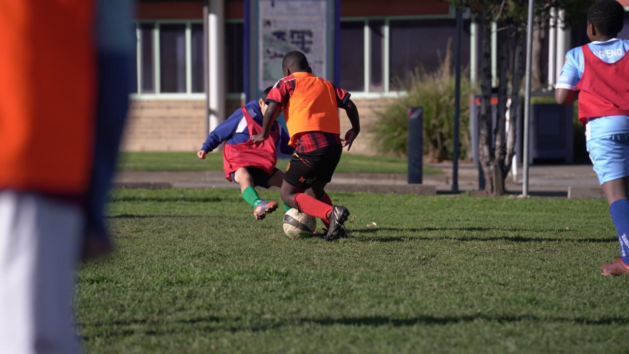 Professional Mastery Football Academy coach running an organised OSHC soccer session in Adelaide