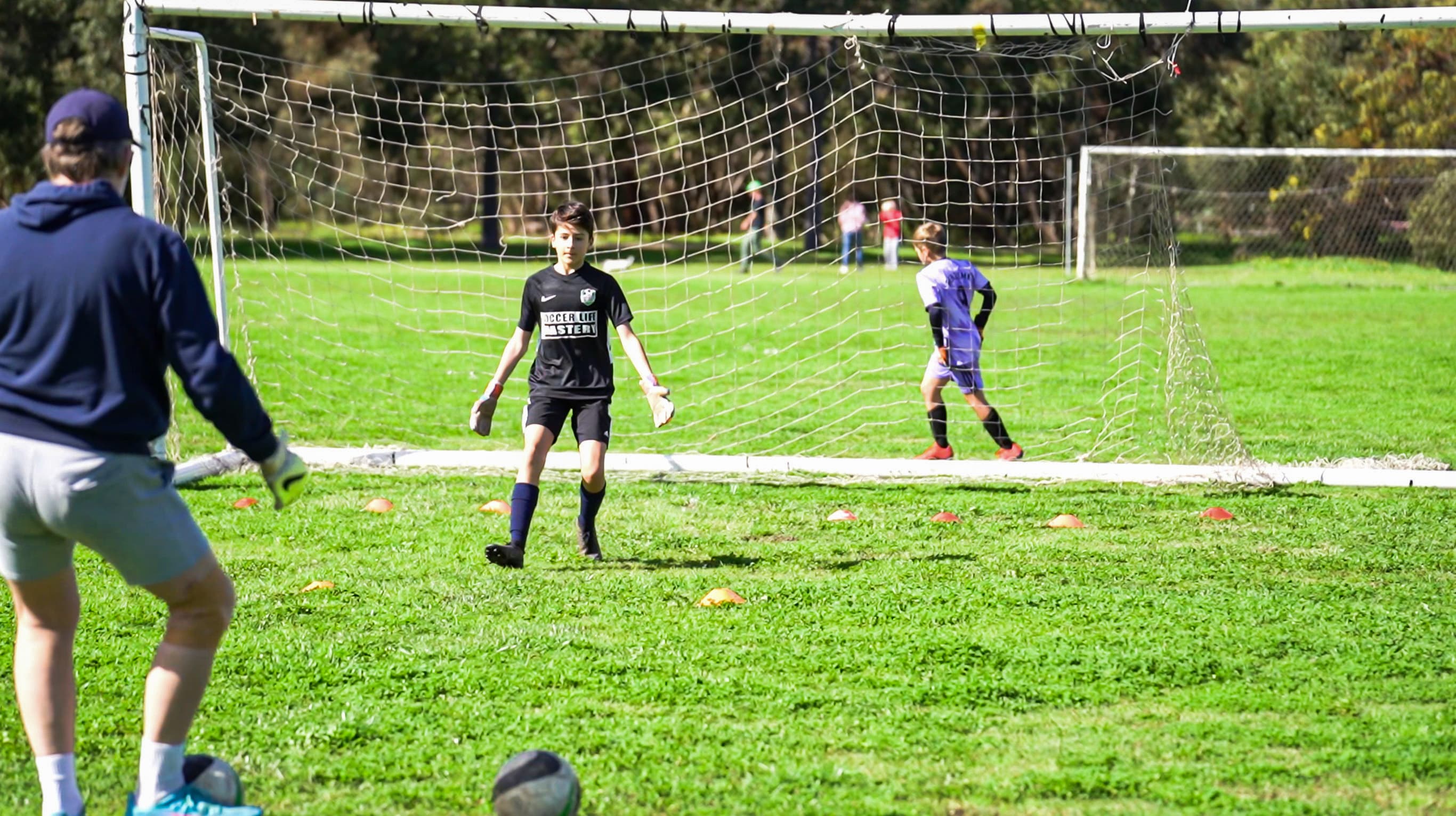 Young goalkeeper at Mastery Football Academy Adelaide learning specialist GK technique for the first time