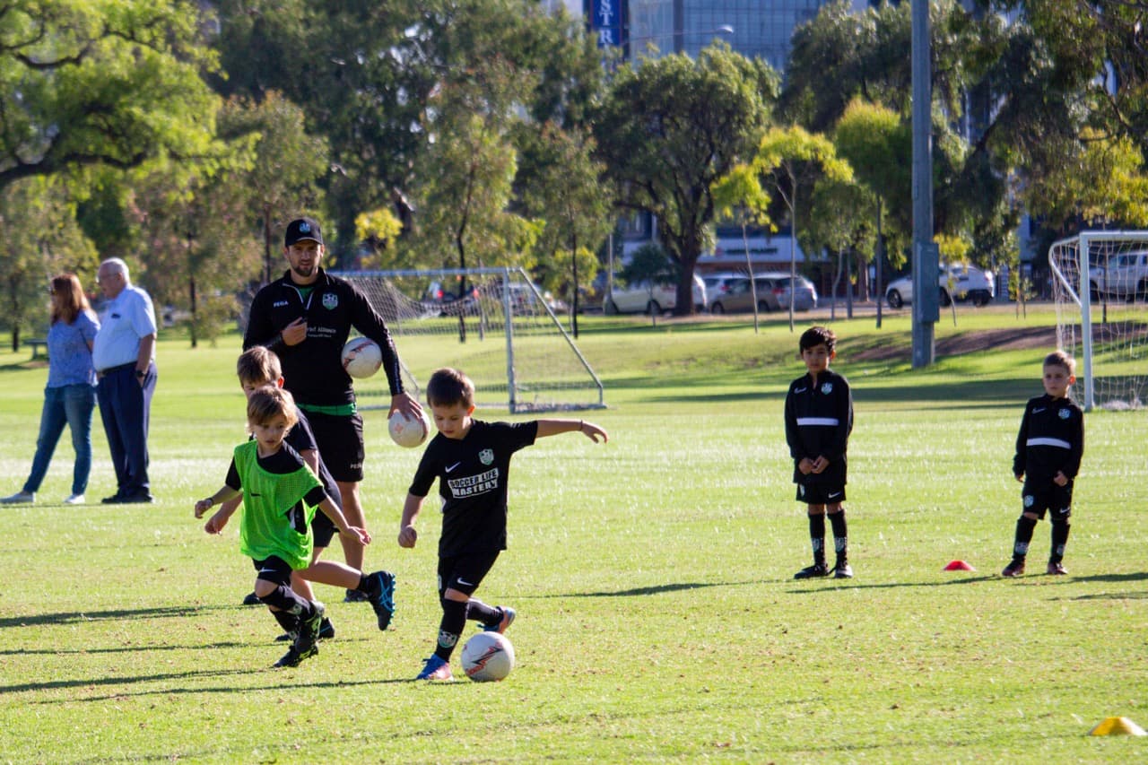 Mini Kickers kids in group action at Mastery Football Academy soccer session Adelaide